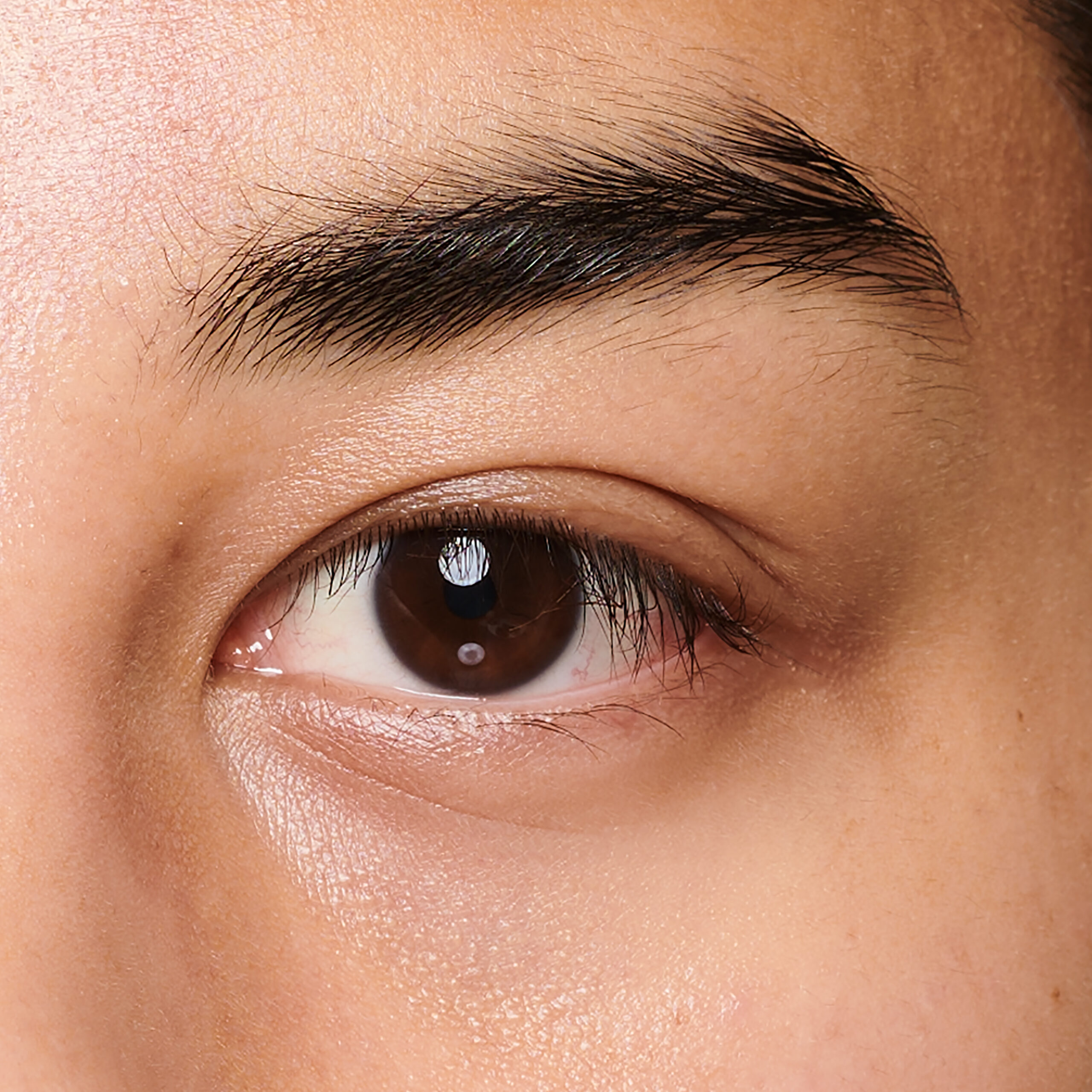 Close-up of eye area before a Healthy Lash Lift + Brow Wax & Dye